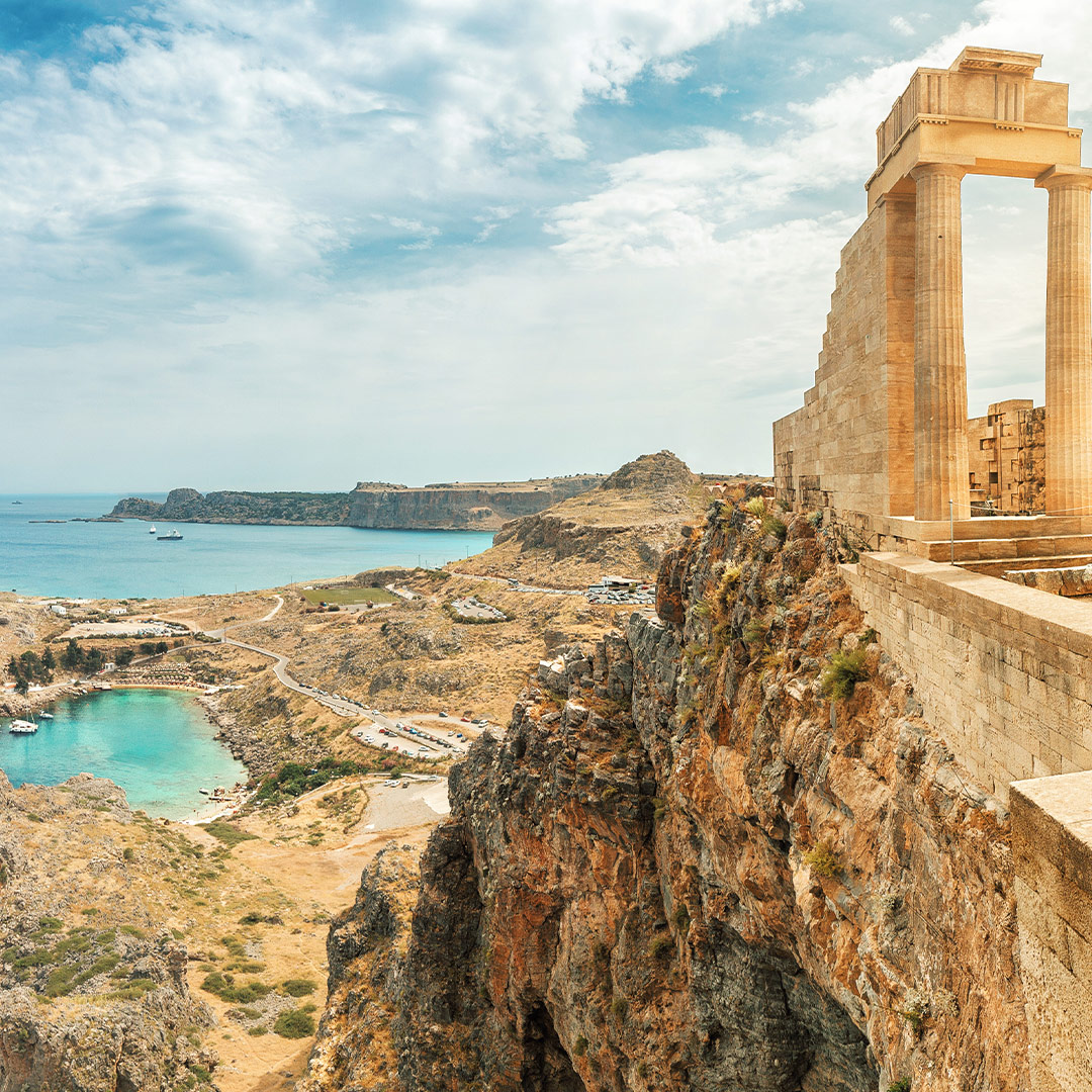 Ancient Acropolis of Lindos in Rhodes, Greece, overlooking turquoise bays and dramatic coastal cliffs.