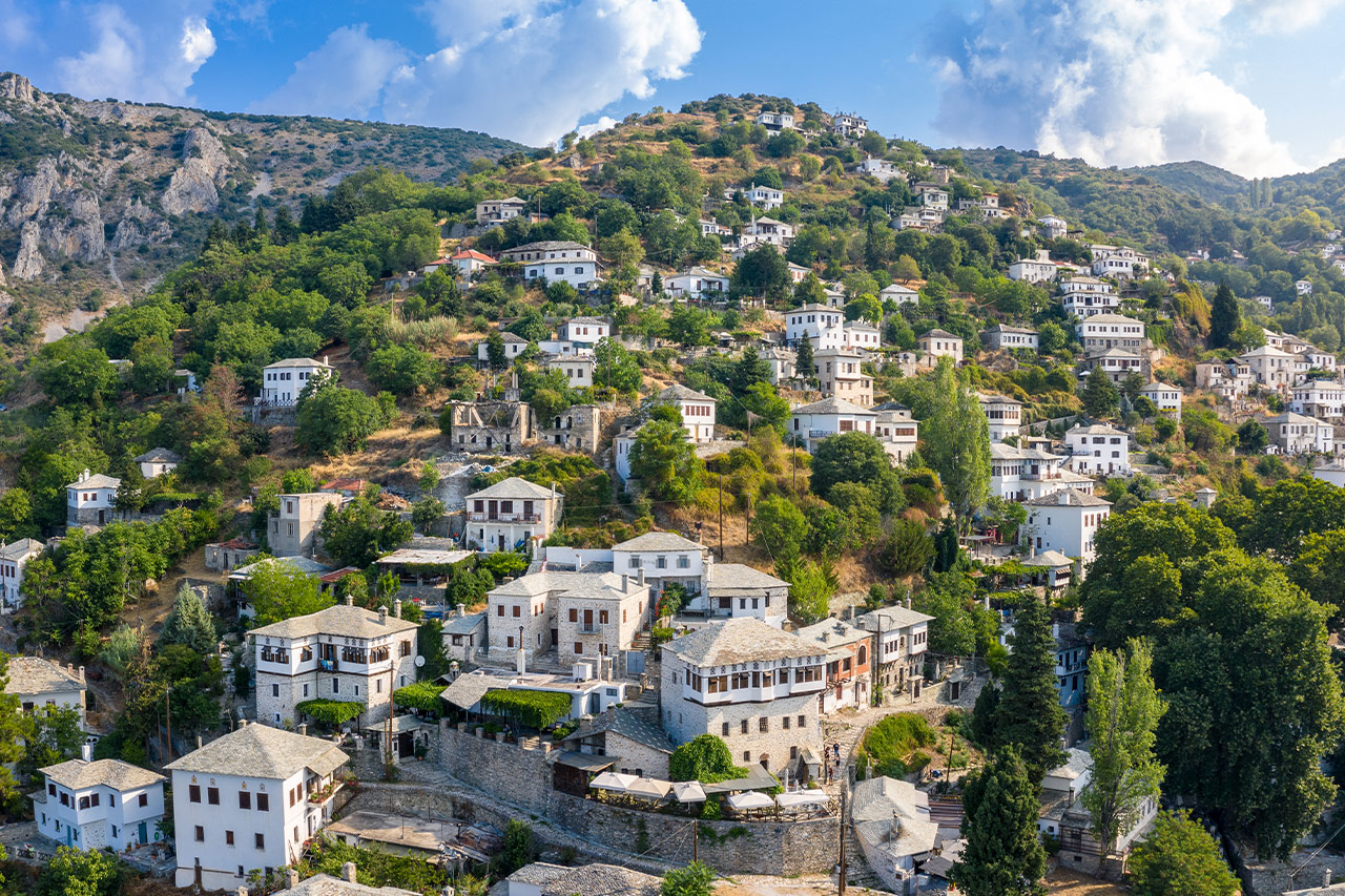 Traditional stone-built villages on the lush slopes of Pelion, Greece, surrounded by forests and mountain views