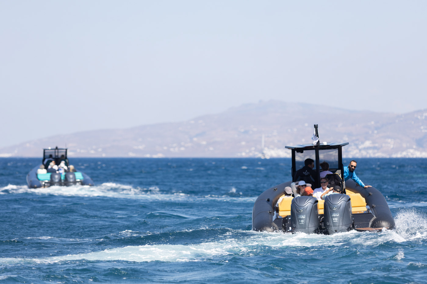 Corporate incentive event in Greece — DMC agency organizing group speedboat adventure across the Aegean Sea for team building and leisure.