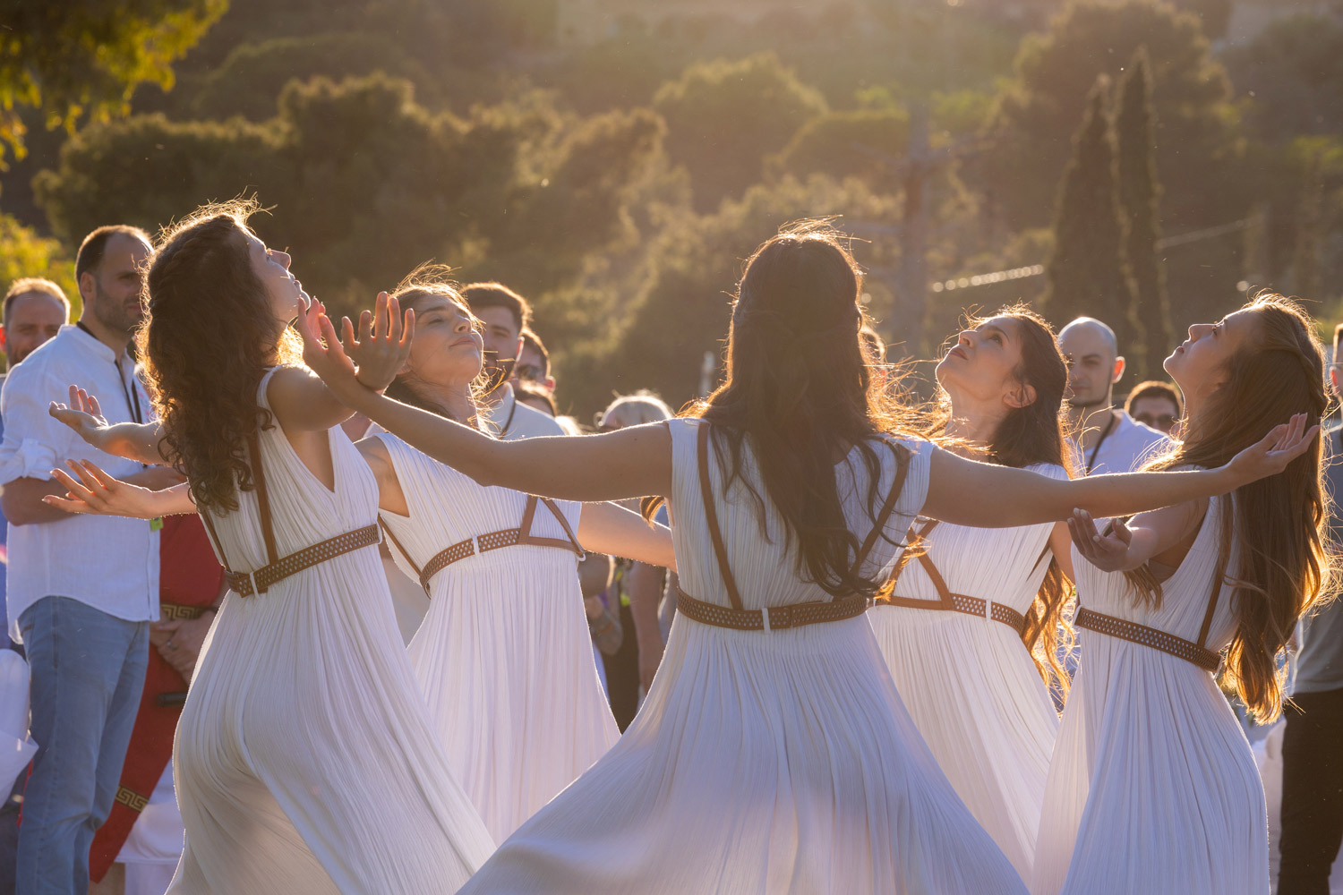 Performers dressed in ancient Greek-inspired costumes during a cultural show organized for a corporate team building and incentive event in Greece, highlighting heritage and connection.