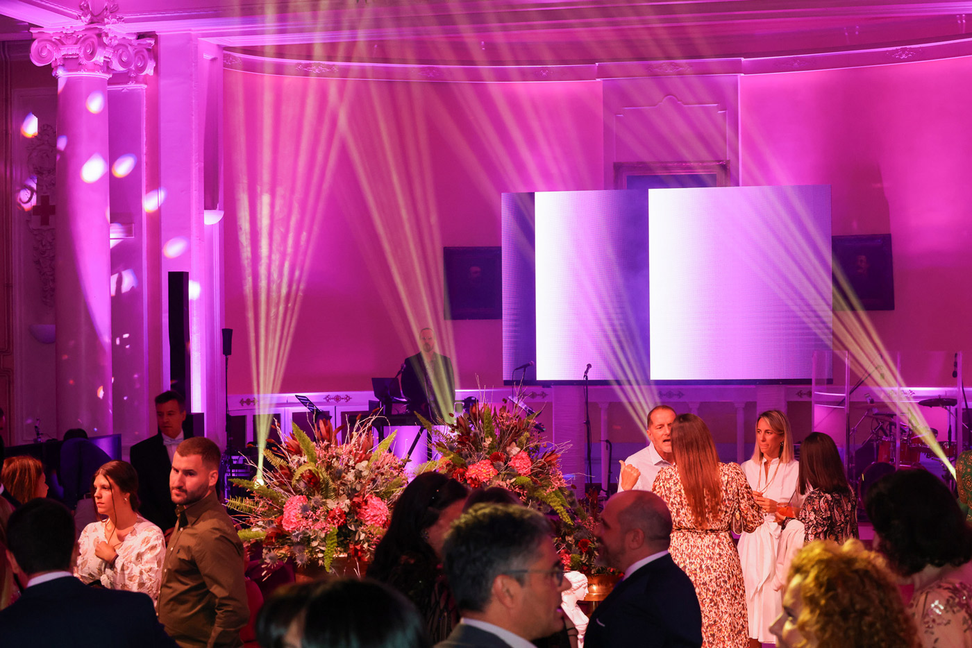 Corporate event in Greece with stage lighting and live music — DMC agency organizing an elegant incentive celebration and networking evening.