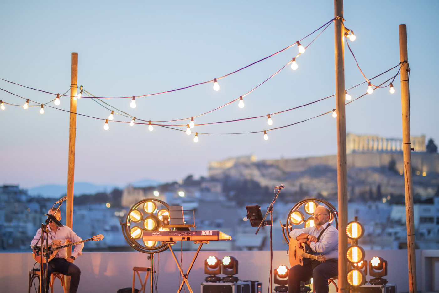 YPO Mayfair corporate event in Greece – rooftop dinner with live Greek music and Acropolis view, curated by DMC agency Feelosophy for incentive tourism and team building.