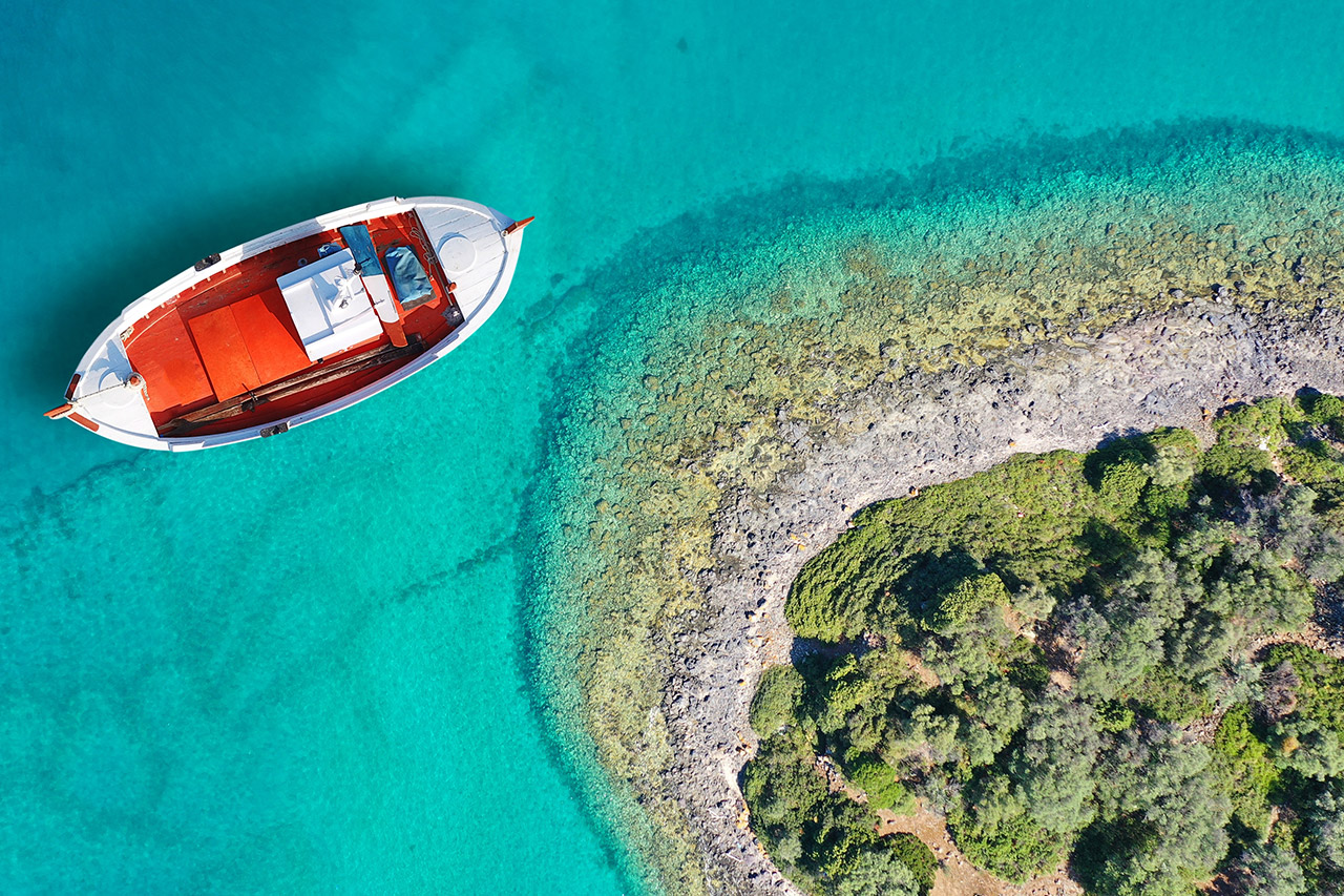Scenic Evia Greece coastline with pine forests and turquoise waters, ideal for incentive trips, experiential travel and corporate retreats