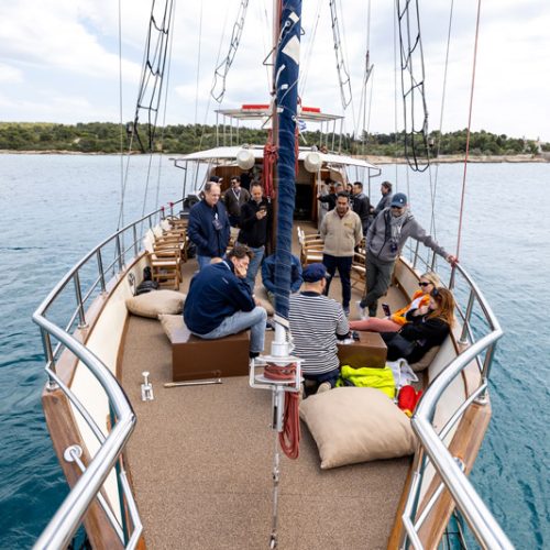 Participants networking aboard sailing vessel during experiential program at EO Regional Leadership Academy